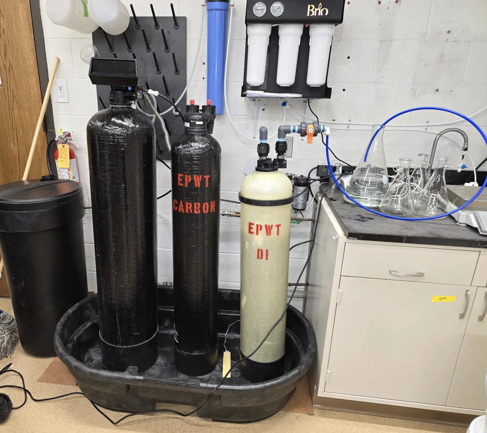 Water softener, carbon filter, and deionization vessels installed in a laboratory water treatment area