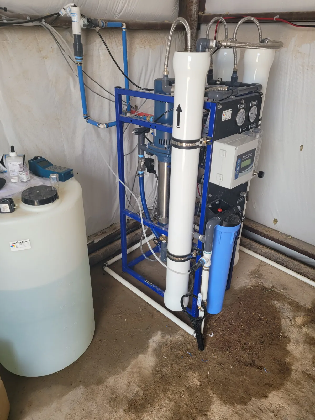 Commercial reverse osmosis skid installed with a chemical feed tank and antiscalant injection equipment